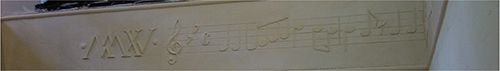 Music notes: an architect’s design for a new build, formed in lime/chalk plaster in relief with background etching